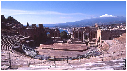 Taormina's Greco-Roman amphitheatre with Etna and the Ionian Sea in the background.